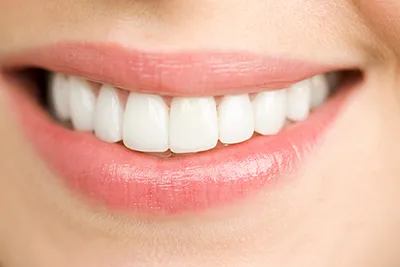 Close up of woman smiling iStock 000029740356 Large 400px